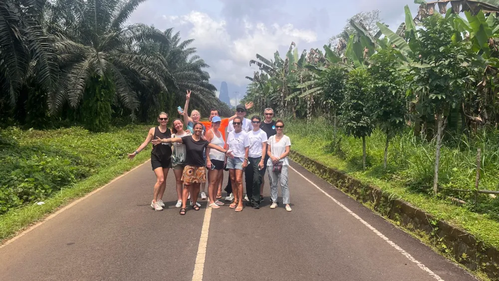 people taking photo in the middle of road