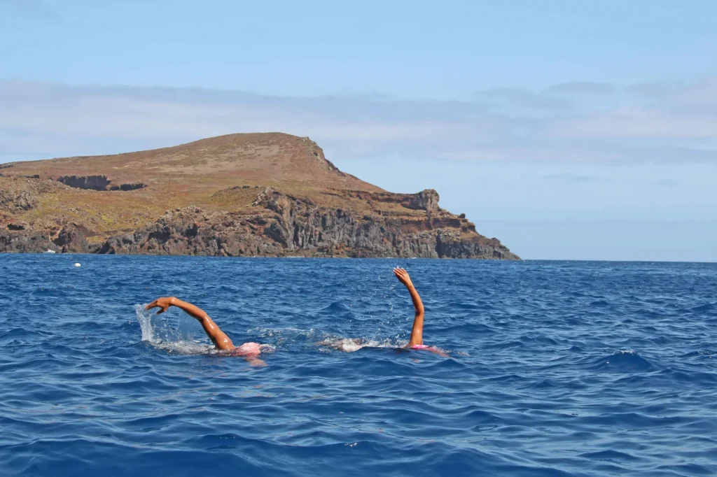 Mayra Santos and Mario Bonanca swimming together at Ponta de Sao Lourenco in the middle of the Atlan